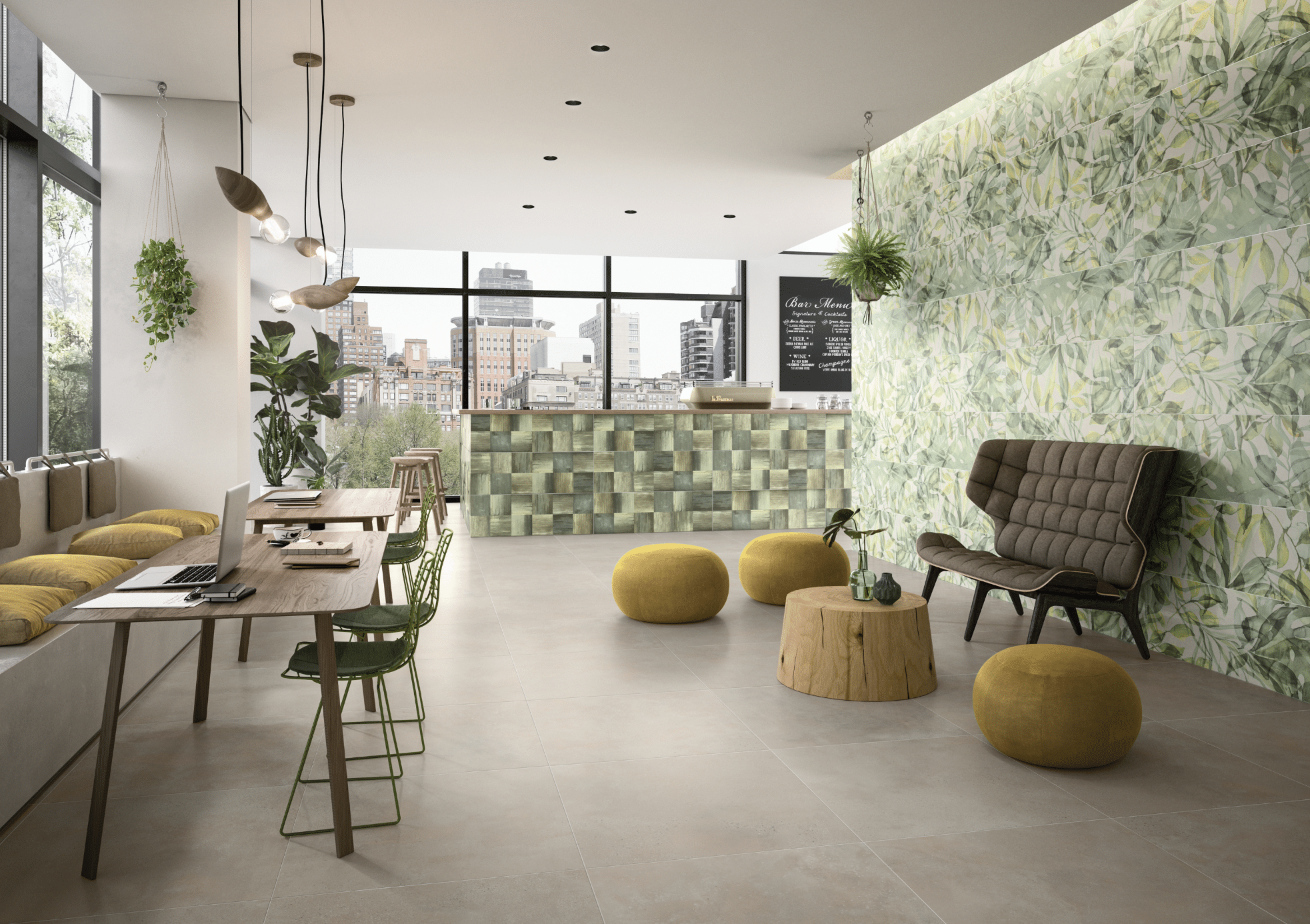 C. Bergmann zeigt ein Cafe mit grün gefliester Bar, dunklen Holztischen mit grünen Stühlen und einer braunen Couch vor einer Wand mit botanischem Muster von Villeroy and Boch.