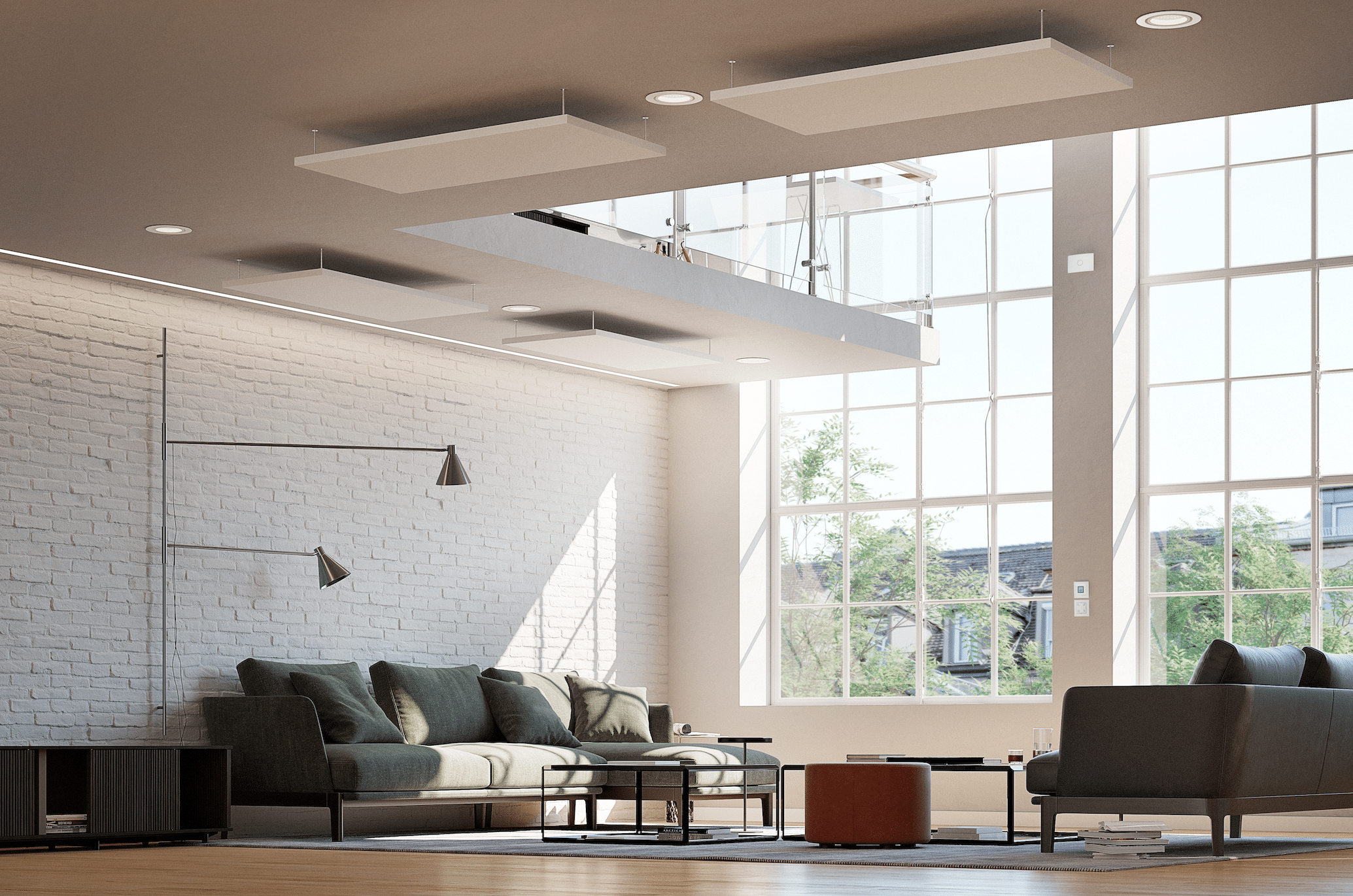 Dimplex zeigt ein modernes Wohnzimmer mit großen Fenstern und einer Betonwand, einer dunkelgrüner Sitzlandschaft und einer Fussbodenheizung die unter dem Holzboden verlegt wurde.