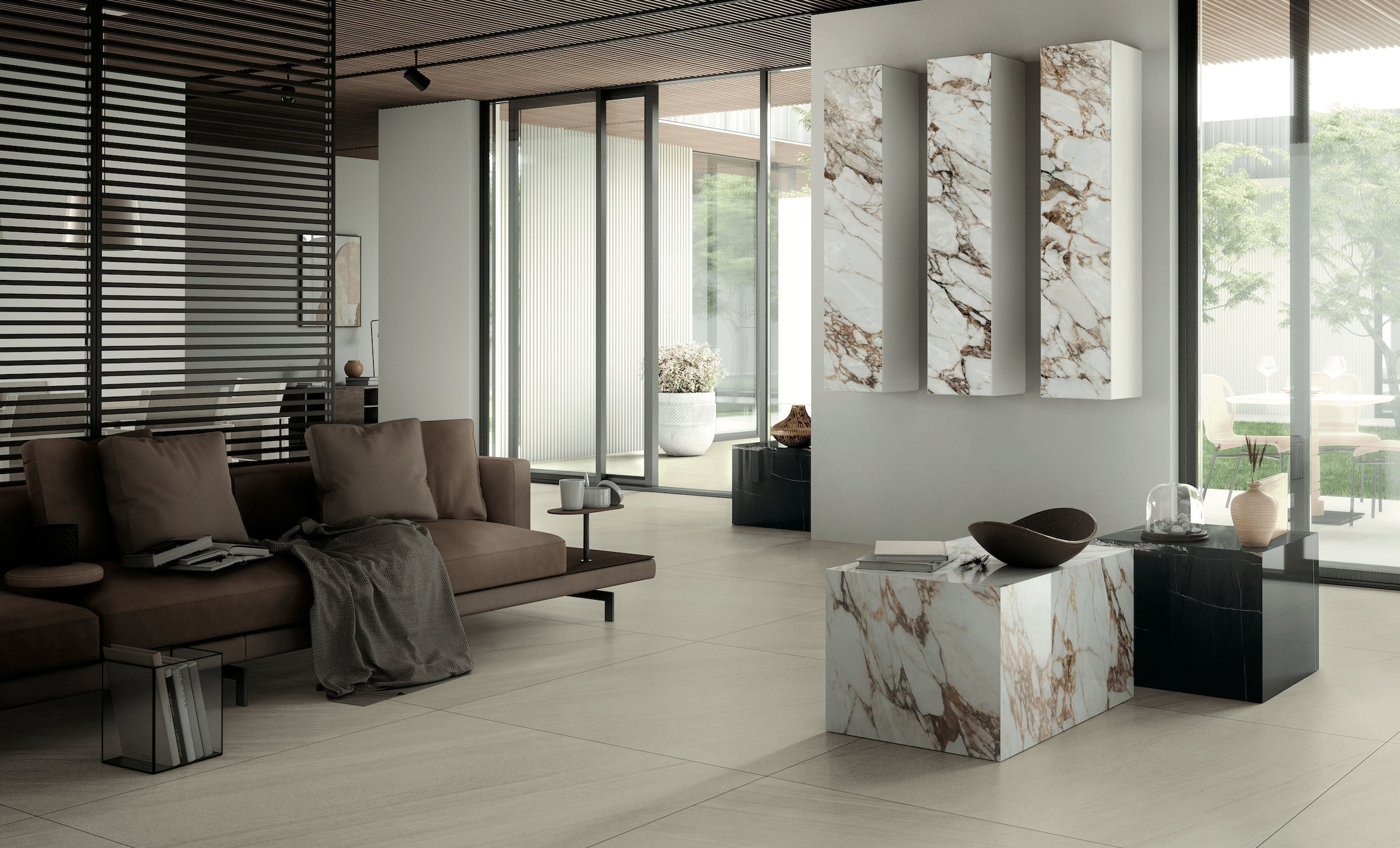 Felbermair Keramikwelt präsentiert ein sehr modernes Wohnzimmer mit braunem Sofa und Wandschränken in marmoriertem Look von Mirage.