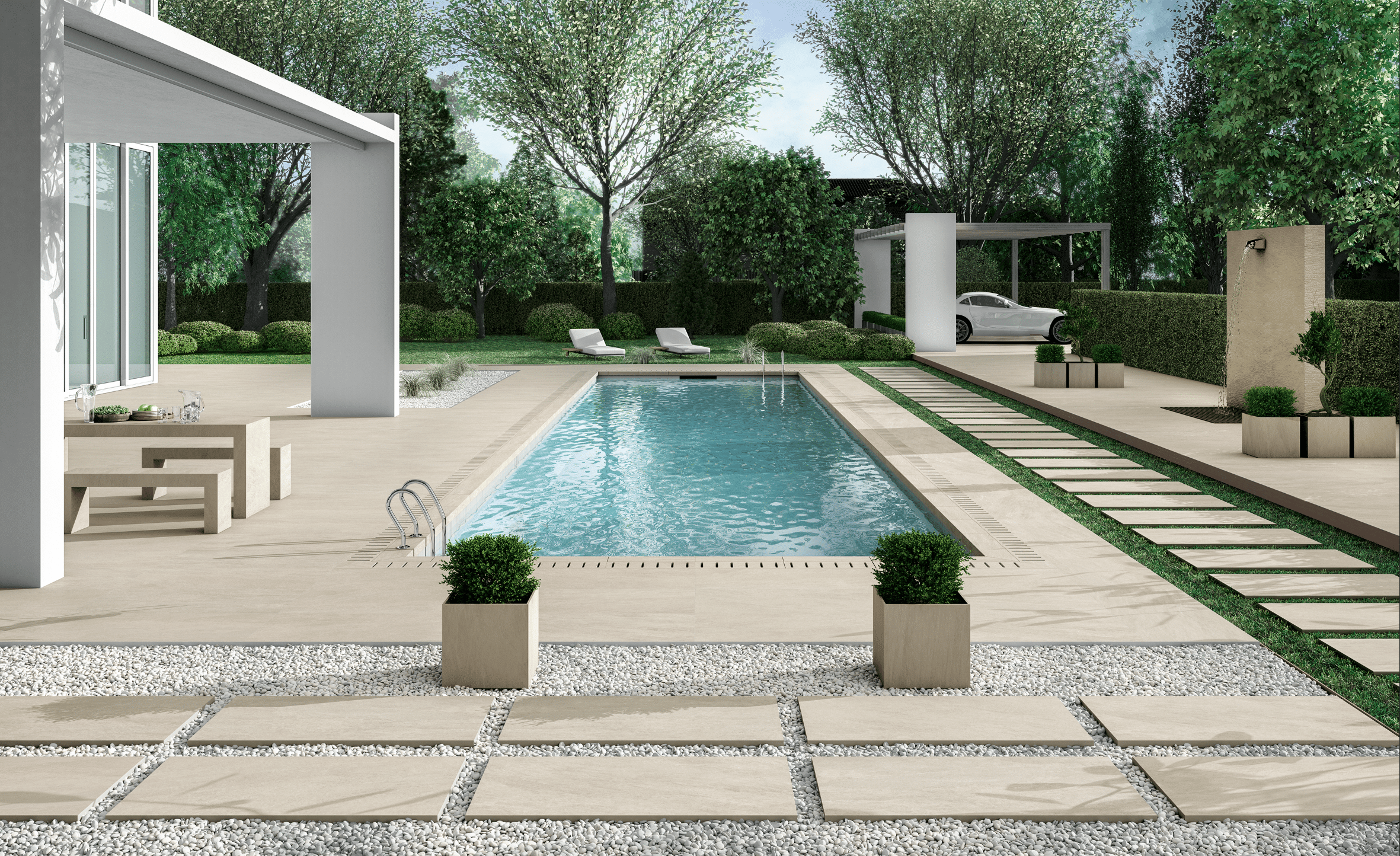 Großzügige Terrasse mit Gartenbereich ausgestattet mit hellen Fliesen von Fliesendorf, Kieselsteinen, Pool, Wasserfall, gefliester Sitzgelegenheit und Carport.