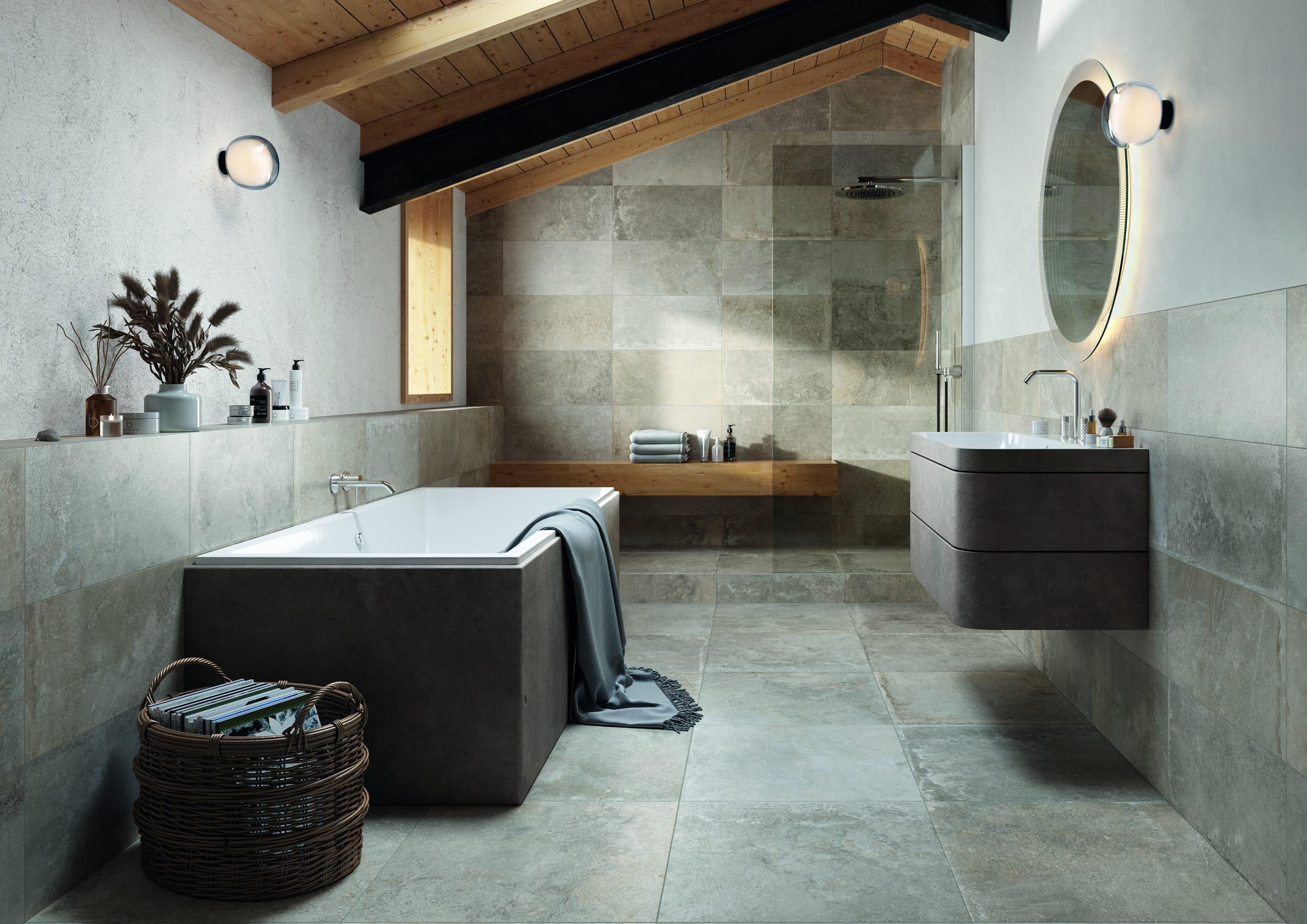 Fliesendorf zeigt ein Badezimmer mit Deckenholzverkleidung, Dachschrägen, einer braunen Badewanne, einem Waschtisch mit Spiegel.
