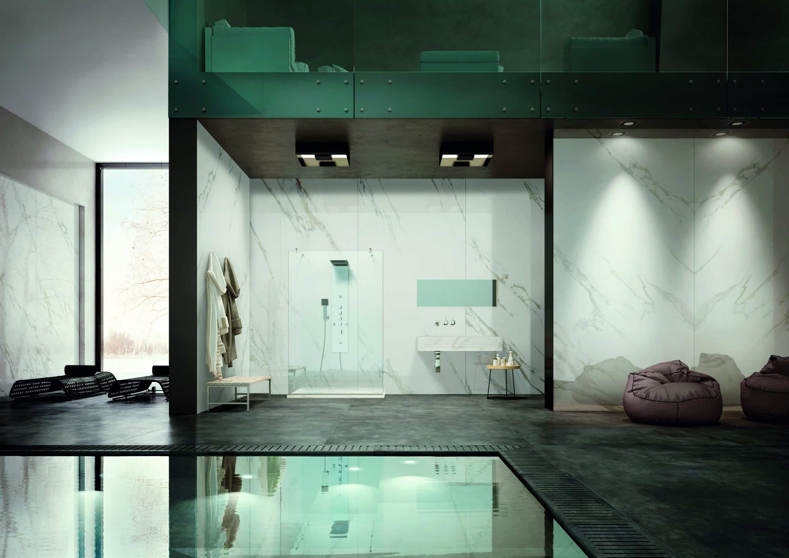 Fliesendorf präsentiert eine Wellnessoase mit Pool, einer Dusche, Sitzsäcken und Liegen mit weißem Marmor an der Wand und dunkelgrauen Fliesen für den Bodenbelag.