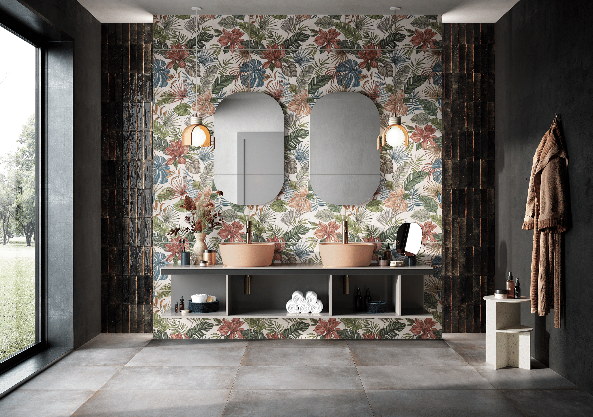 Fliesendorf zeigt ein Badezimmer mit rosa Doppelwaschbecken, zwei ovalen Spiegeln auf der Wand mit Blumentapete montiert und grauen Fliesen am Boden.