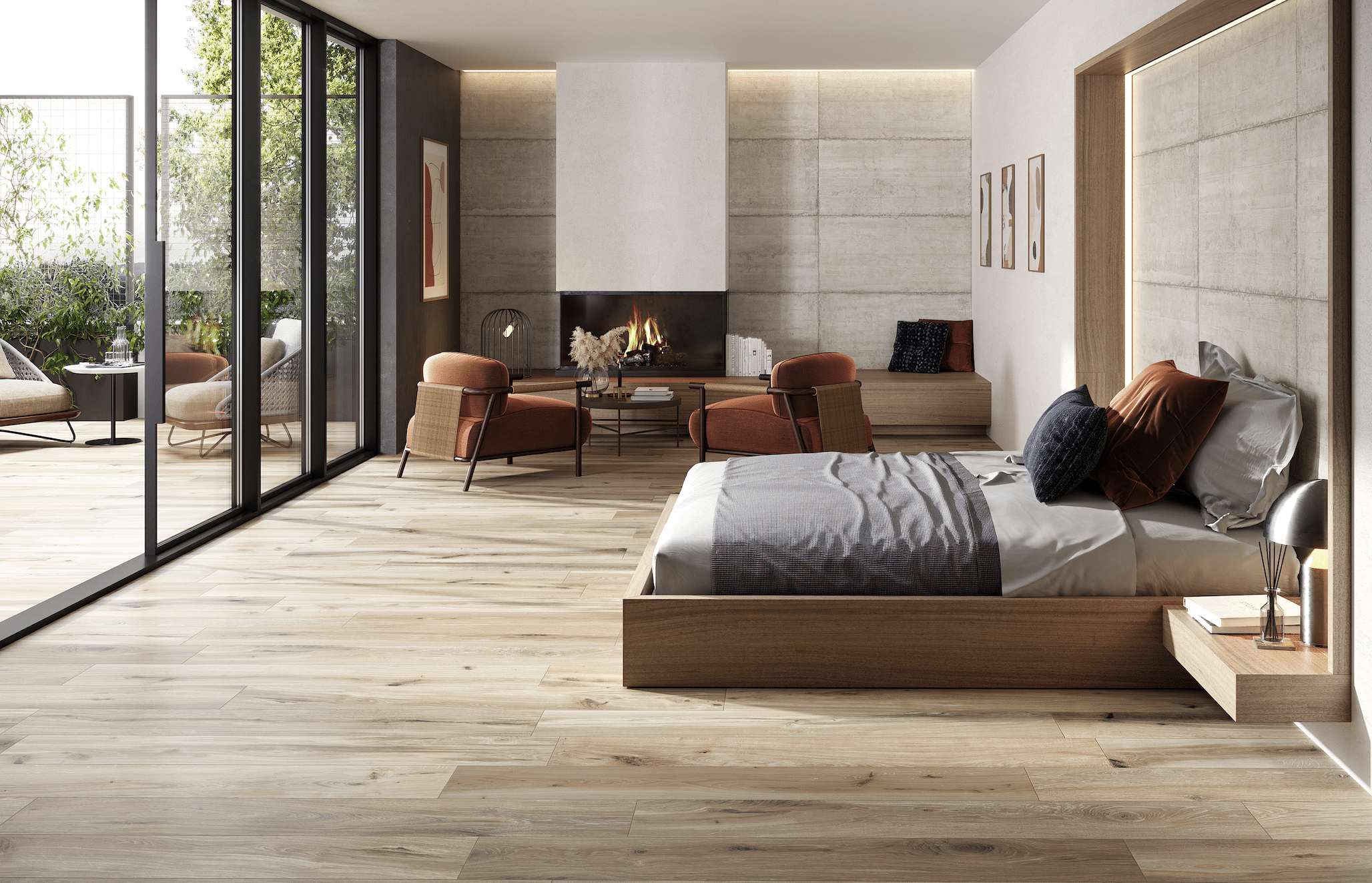 Fliesendorf zeigt ein großzügiges Schlafzimmer mit Fliesendielen in Holzoptik, ein modernes Doppelbett, einen gemauerten Kamin sowie eine bodenbündige Ganzglas-Lösung.