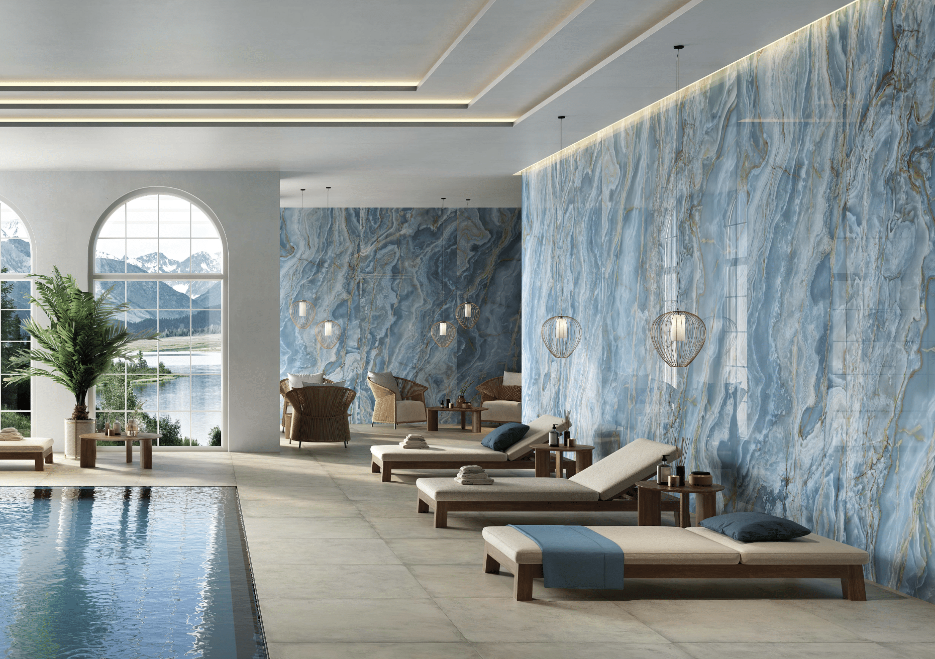Fliesendorf zeigt ein schönes Spa mit großem Pool und gemütlichen Liegen vor einer blau marmorierten Wand und einen hellen Fliesenboden.
