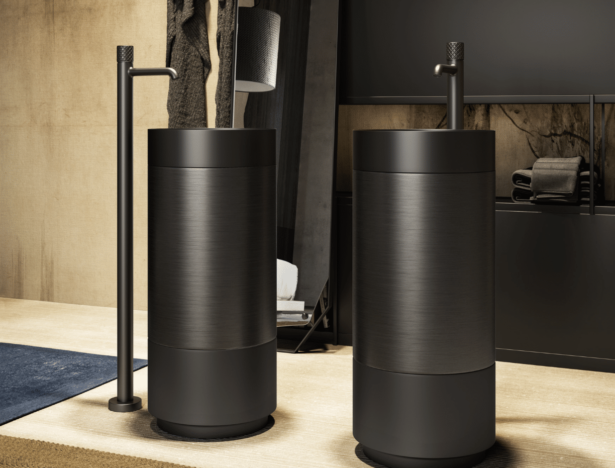 GESSI zeigt zwei zylinderförmige Waschtische in schwarz mit schwarzen Armaturen vom Boden aus.