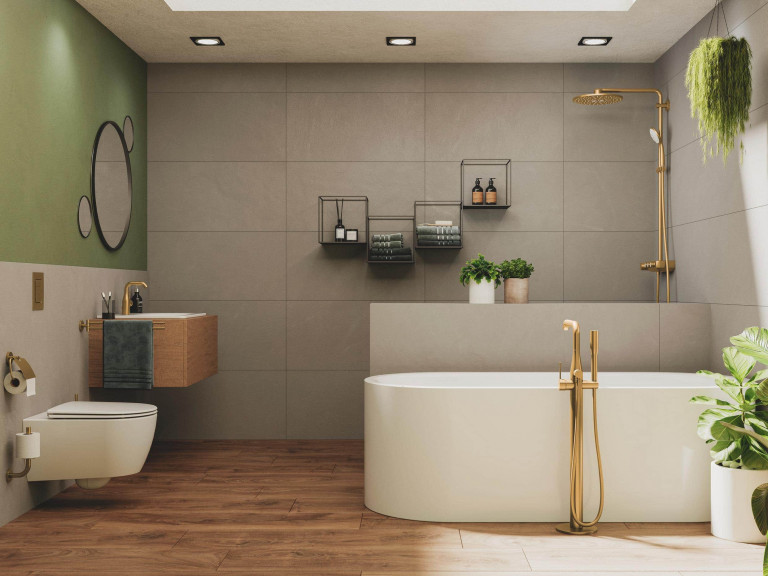 Badezimmer mit Armaturen in matt Gold von Grohe mit Duschnische und Trennmauer, freistehender weißen Badewanne, weißem Waschbecken mit Holz-Unterbau, Wand-WC.