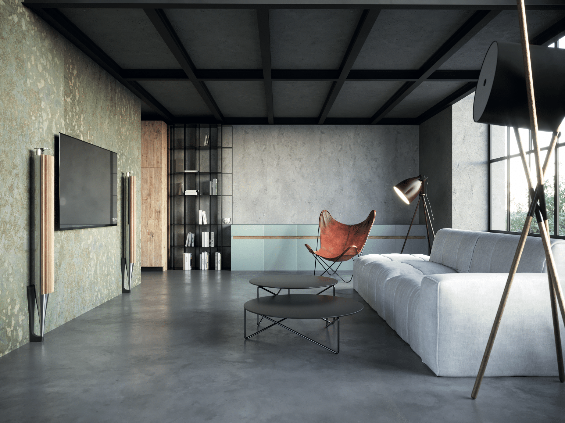 KRONOSPAN zeigt einen offenen Wohnbereich im Industrial Style mit einer hellgrauen Couch, schwarzen Beistelltischen und einem braunen Ledersessel.