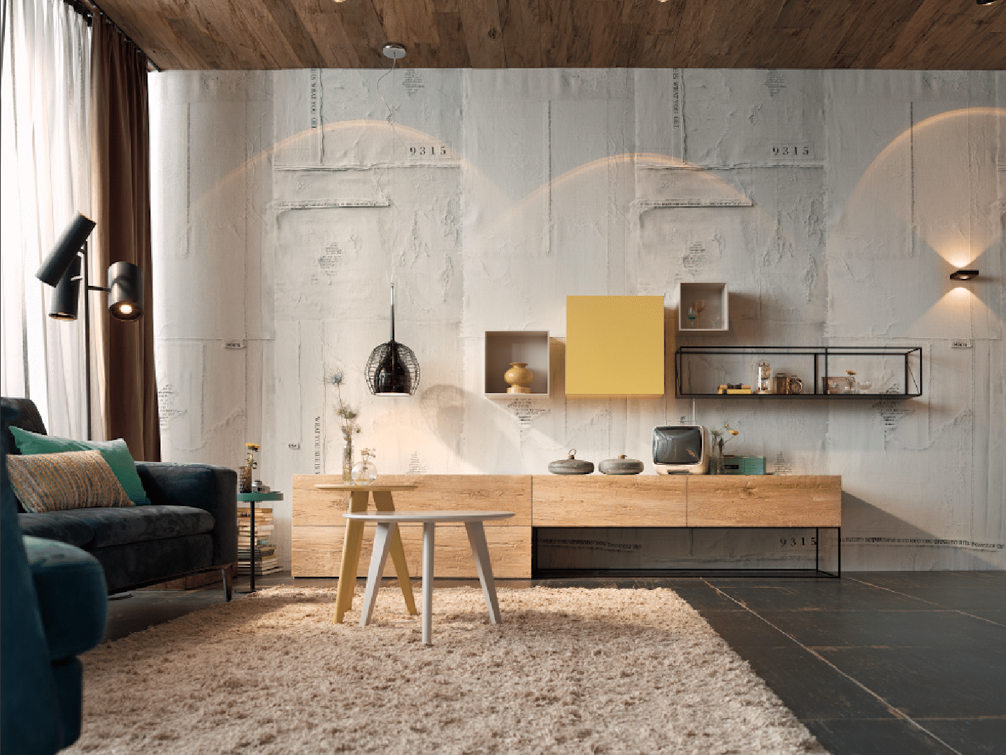 Wohnzimmer mit einem Hauch Industrial Style mit kontrastierendem Teppich, einem Lowboard in Holzoptik und Hängeregalen von haas.
